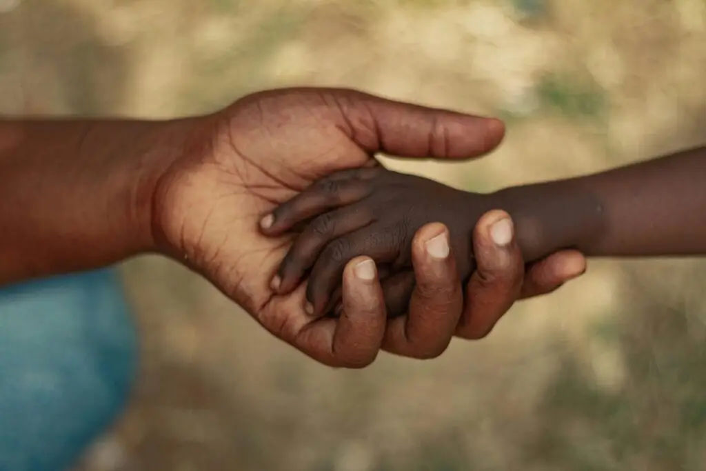 Holding Hand of a Baby and a Person